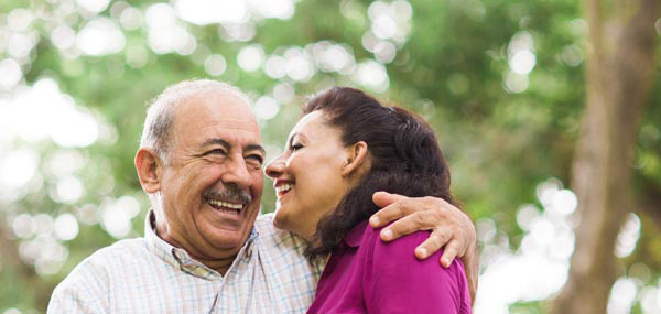 couple standing on bridge outside mobile